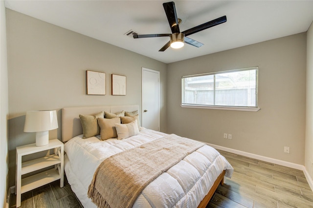 17434 Jolly Boat Dr, Crosby, TX 77532 - bedroom with baseboards, wood finished floors, and ceiling fan