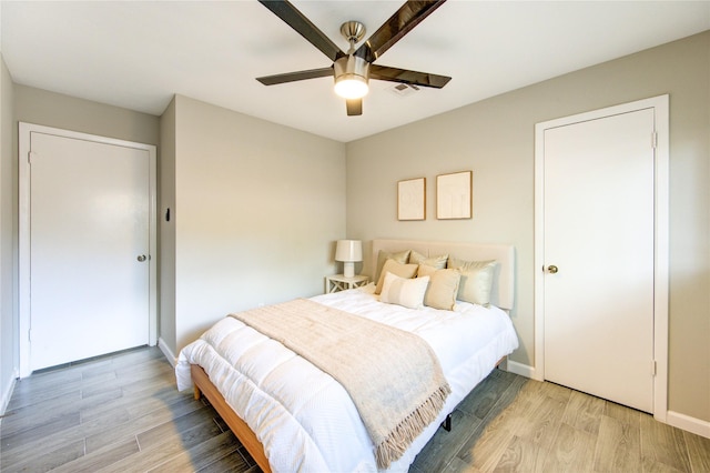17434 Jolly Boat Dr, Crosby, TX 77532 - bedroom with light wood-style flooring, baseboards, and ceiling fan