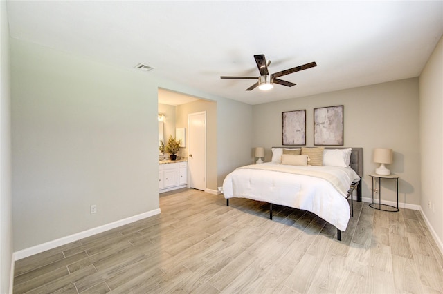17434 Jolly Boat Dr, Crosby, TX 77532 - bedroom with light wood-style flooring, baseboards, ceiling fan, and connected bathroom