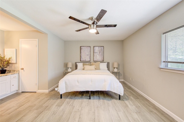 17434 Jolly Boat Dr, Crosby, TX 77532 - bedroom with light wood-type flooring, baseboards, and ceiling fan