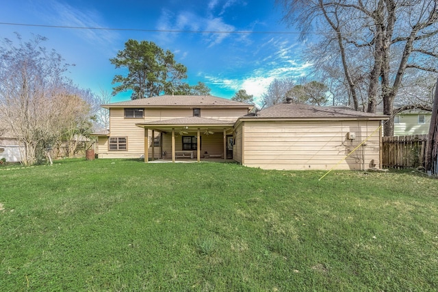 back of house with a yard, a ceiling fan, a patio area, and a fenced backyard