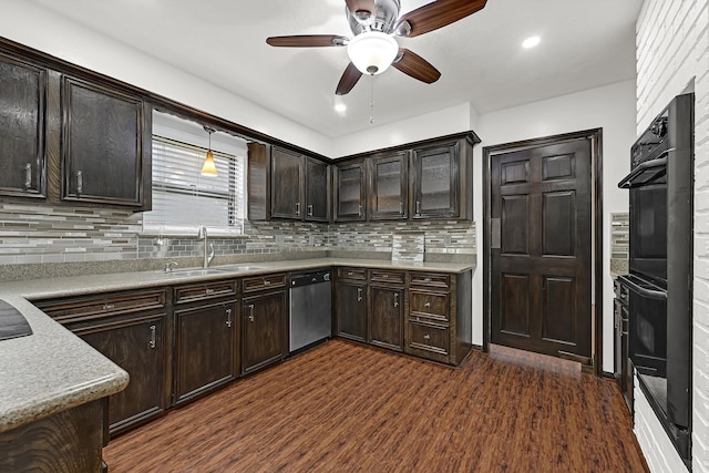 kitchen featuring stainless steel dishwasher, a sink, dark wood-style flooring, tasteful backsplash, and ceiling fan