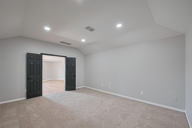 2006 Deer Vly, Missouri City, TX 77459 - spare room featuring visible vents, baseboards, carpet, and lofted ceiling
