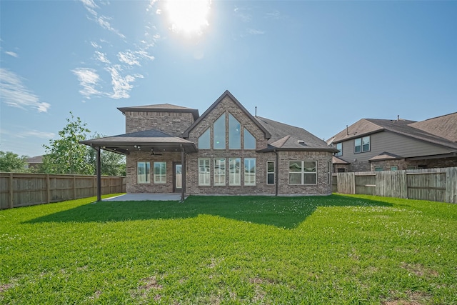 2006 Deer Vly, Missouri City, TX 77459 - back of property with a fenced backyard, ceiling fan, a patio area, and a yard