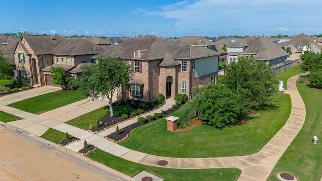 2006 Deer Vly, Missouri City, TX 77459 - view of front facade with concrete driveway, brick siding, a residential view, and a garage