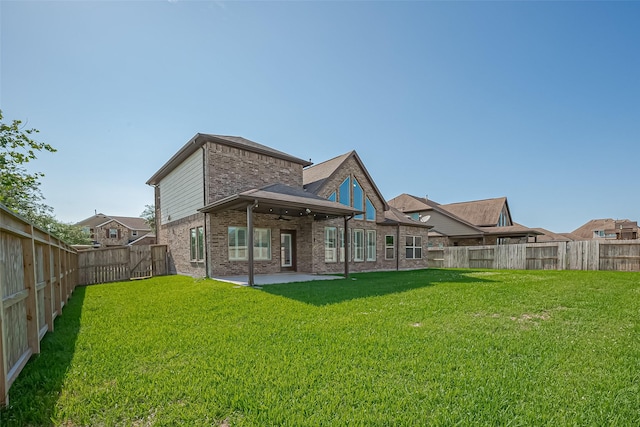 2006 Deer Vly, Missouri City, TX 77459 - back of property with a fenced backyard, a ceiling fan, a patio, and a yard