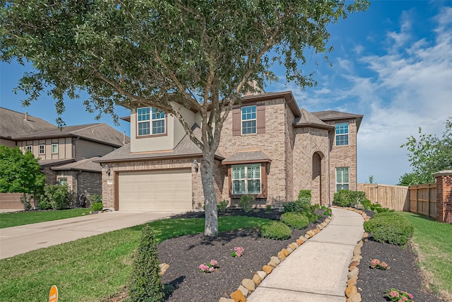 2006 Deer Vly, Missouri City, TX 77459 - traditional-style house with fence, a garage, driveway, and brick siding