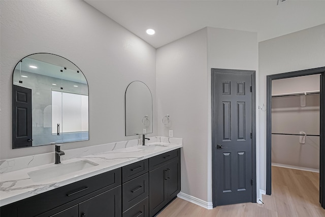 2006 Deer Vly, Missouri City, TX 77459 - full bathroom with a sink, double vanity, and wood finished floors