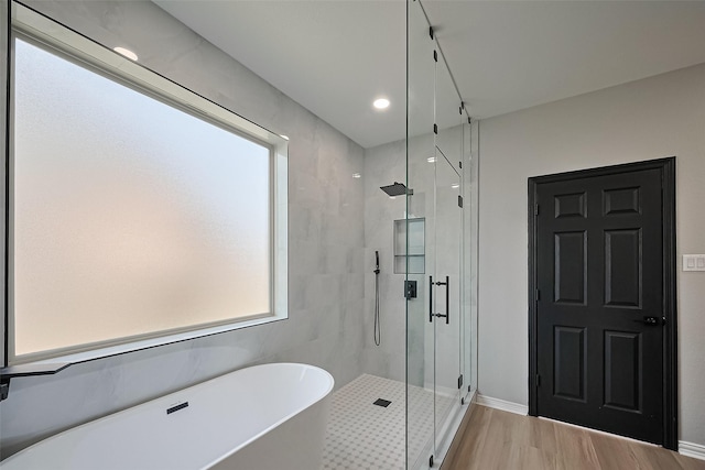 2006 Deer Vly, Missouri City, TX 77459 - full bath with wood finished floors, recessed lighting, a soaking tub, and a stall shower