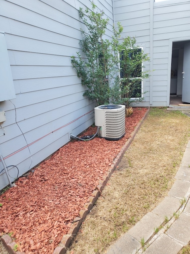 view of yard with central AC unit