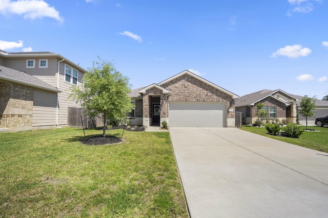 view of front of home with fence, concrete driveway, an attached garage, brick siding, and a front yard