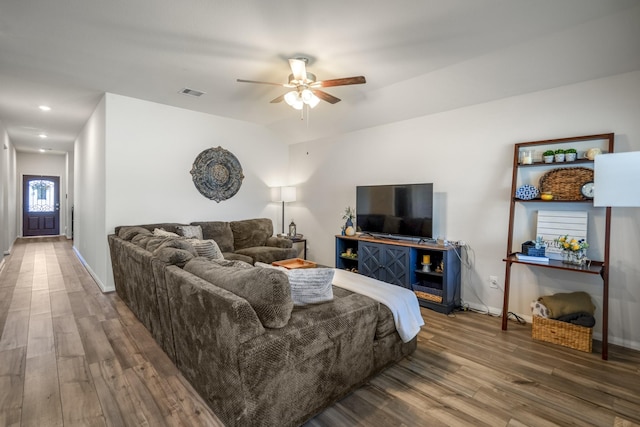 living area featuring recessed lighting, wood finished floors, visible vents, baseboards, and ceiling fan