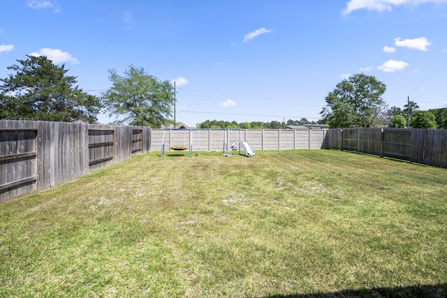 view of yard with a fenced backyard