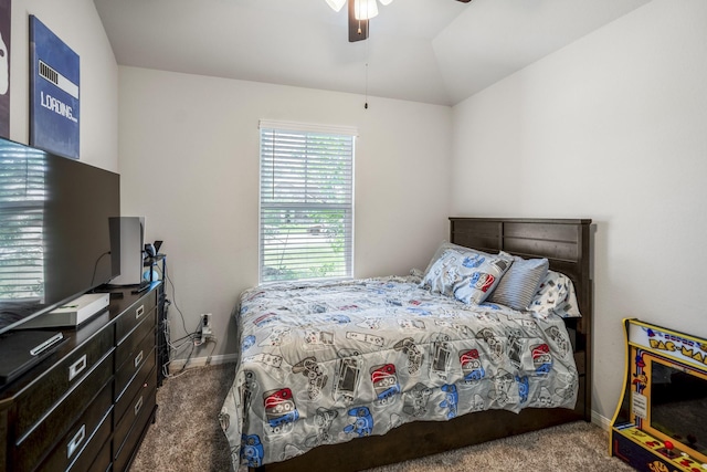 carpeted bedroom featuring baseboards, a ceiling fan, and vaulted ceiling