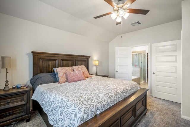 carpeted bedroom with lofted ceiling, ensuite bathroom, visible vents, and baseboards