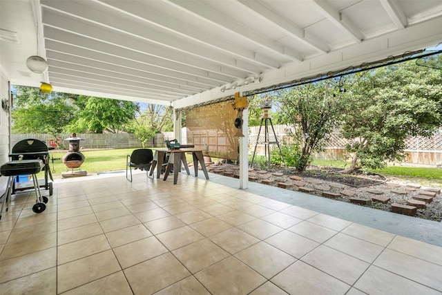 view of patio featuring area for grilling, a fenced backyard, and outdoor dining space
