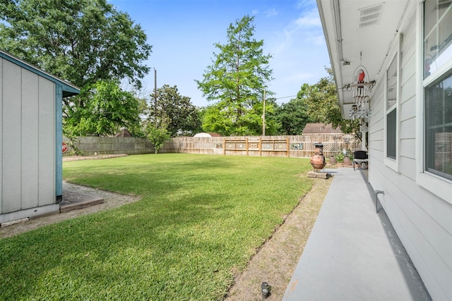view of yard with a fenced backyard