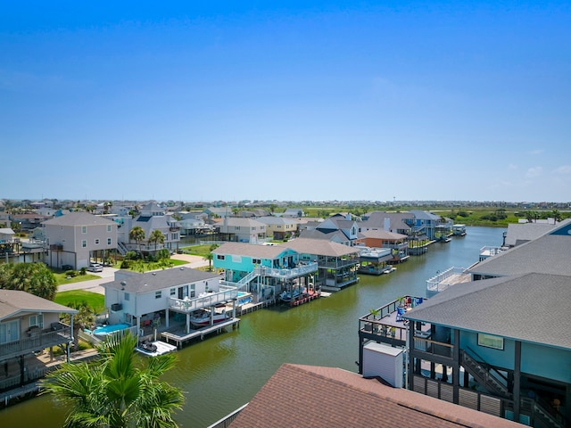 bird's eye view with a residential view and a water view
