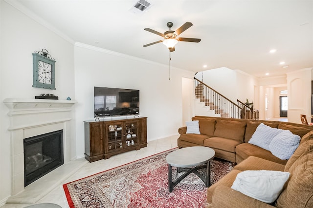 living area with recessed lighting, stairway, visible vents, a ceiling fan, and ornamental molding