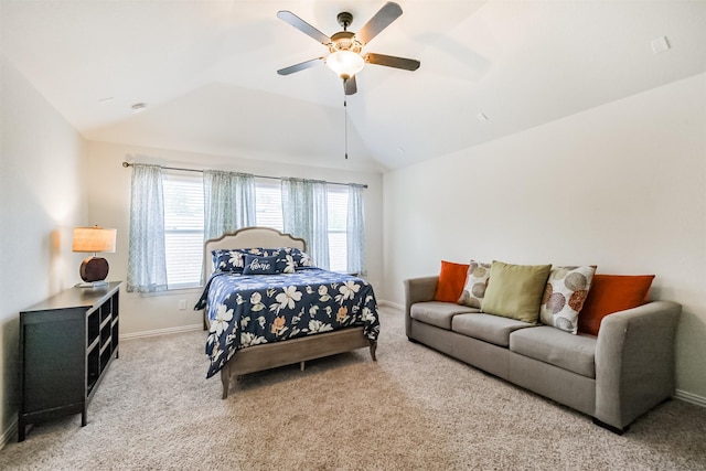 carpeted bedroom featuring lofted ceiling, a ceiling fan, and baseboards