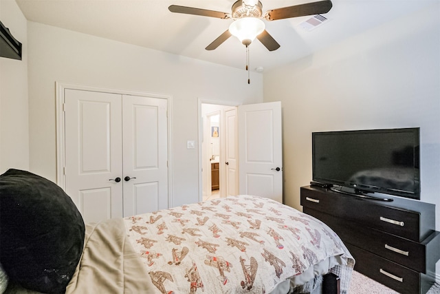 bedroom with a ceiling fan, visible vents, and a closet