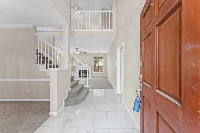 15306 Goodman St, Houston, TX 77084 - entrance foyer with light marble finish flooring, stairs, and ceiling fan