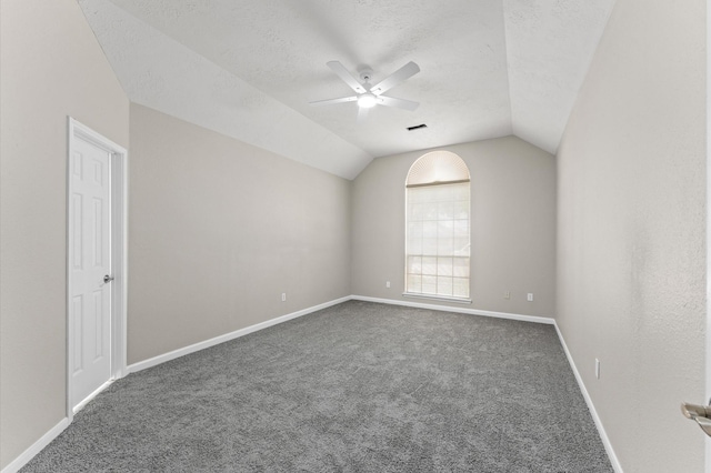15306 Goodman St, Houston, TX 77084 - unfurnished room with carpet, lofted ceiling, a textured ceiling, a ceiling fan, and baseboards