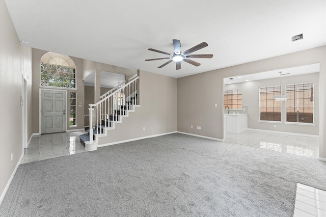 15306 Goodman St, Houston, TX 77084 - unfurnished living room featuring carpet floors, baseboards, and a ceiling fan