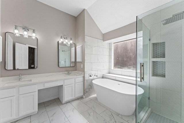 15306 Goodman St, Houston, TX 77084 - bathroom with marble look tiles, a shower stall, double vanity, a soaking tub, and lofted ceiling