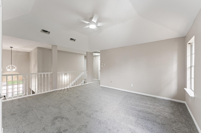 15306 Goodman St, Houston, TX 77084 - carpeted empty room featuring ceiling fan, healthy amount of natural light, lofted ceiling, and baseboards