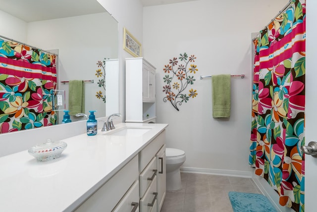 7702 Royal Oasis Ln, Cypress, TX 77433 - bathroom with tile patterned floors, toilet, baseboards, a shower with shower curtain, and vanity