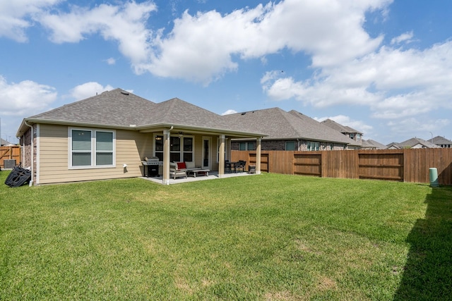 7702 Royal Oasis Ln, Cypress, TX 77433 - rear view of property with a fenced backyard, a patio, and a lawn