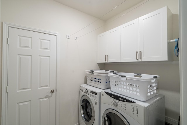 7702 Royal Oasis Ln, Cypress, TX 77433 - clothes washing area featuring cabinet space and independent washer and dryer