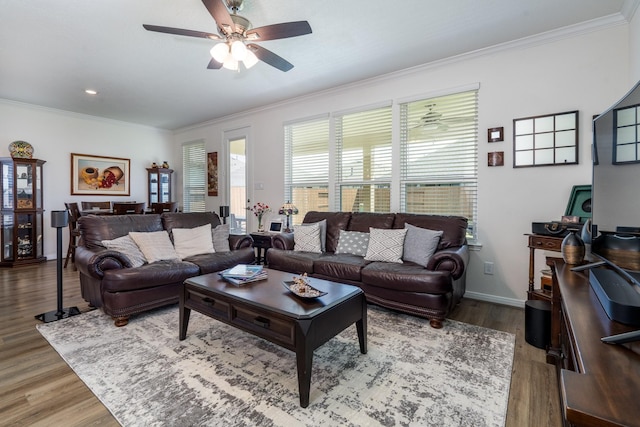 7702 Royal Oasis Ln, Cypress, TX 77433 - living room with wood finished floors, crown molding, baseboards, and ceiling fan