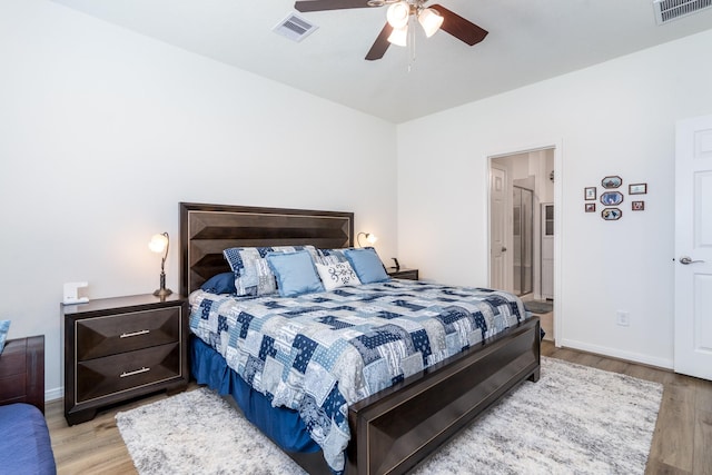 7702 Royal Oasis Ln, Cypress, TX 77433 - bedroom with baseboards, light wood-style floors, and visible vents