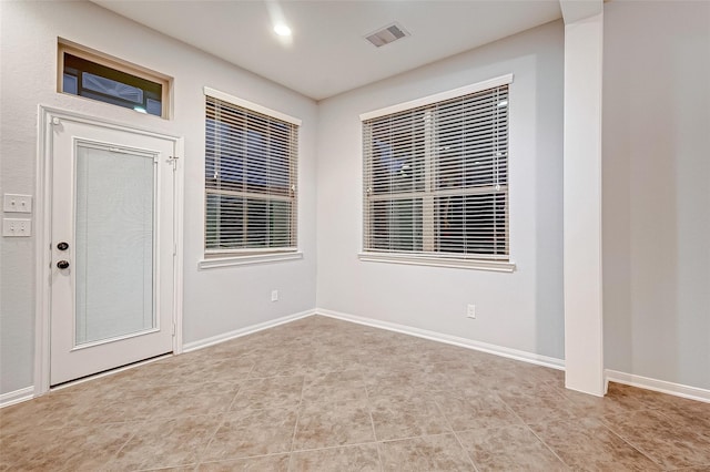 entrance foyer featuring baseboards and visible vents
