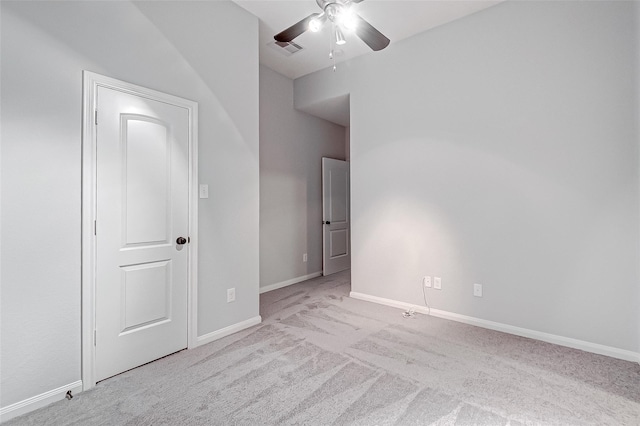 unfurnished bedroom featuring ceiling fan, baseboards, visible vents, and carpet