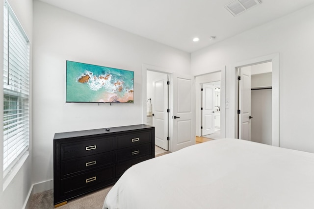 bedroom with baseboards, visible vents, and recessed lighting