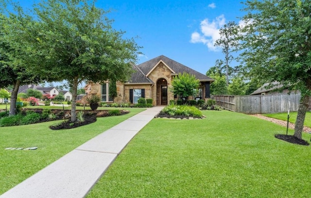12603 Mostyn Ct, Magnolia, TX 77354 - view of front of house featuring fence and a front lawn