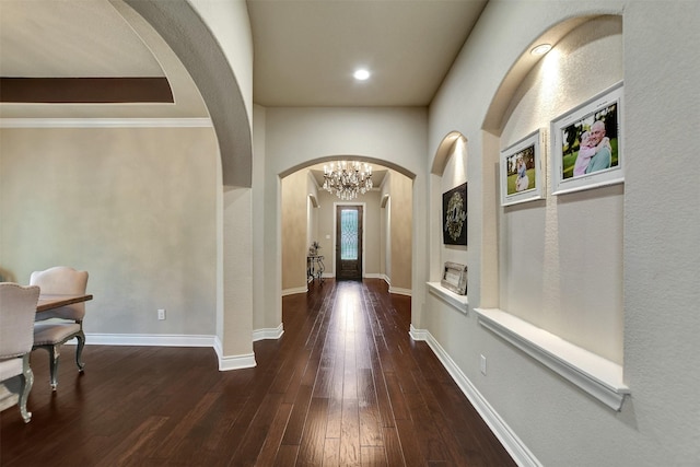 12603 Mostyn Ct, Magnolia, TX 77354 - hallway with baseboards, hardwood / wood-style flooring, arched walkways, a chandelier, and recessed lighting