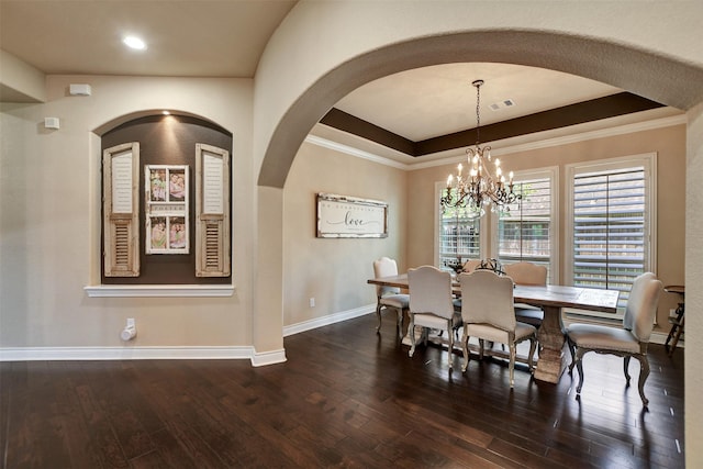 12603 Mostyn Ct, Magnolia, TX 77354 - dining area featuring a notable chandelier, arched walkways, hardwood / wood-style floors, and baseboards
