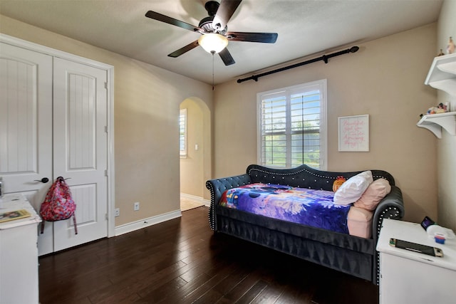 12603 Mostyn Ct, Magnolia, TX 77354 - bedroom with ceiling fan, wood-type flooring, arched walkways, and baseboards