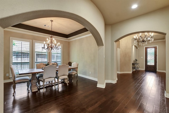 12603 Mostyn Ct, Magnolia, TX 77354 - dining room with an inviting chandelier, hardwood / wood-style floors, and arched walkways