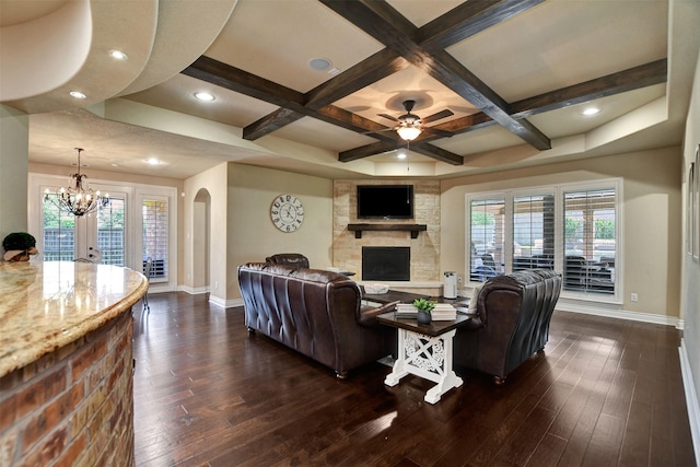 12603 Mostyn Ct, Magnolia, TX 77354 - living area with coffered ceiling, dark wood-style flooring, baseboards, and arched walkways