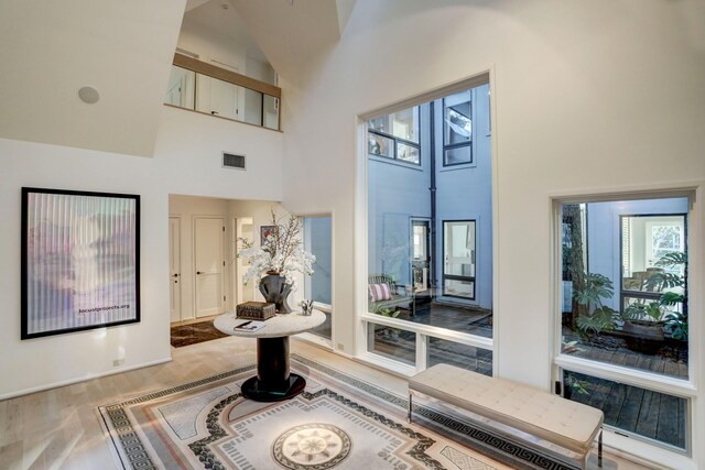 2003 Arrowwood Cir N, Houston, TX 77063 - interior space with high vaulted ceiling, wood finished floors, and visible vents