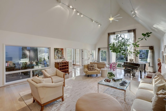 2003 Arrowwood Cir N, Houston, TX 77063 - living room with track lighting, ceiling fan, hardwood / wood-style flooring, and high vaulted ceiling