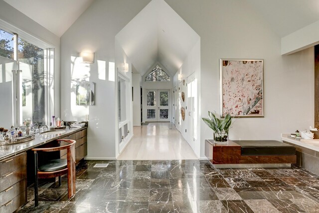 2003 Arrowwood Cir N, Houston, TX 77063 - interior space featuring french doors, high vaulted ceiling, marble finish floor, and a sink