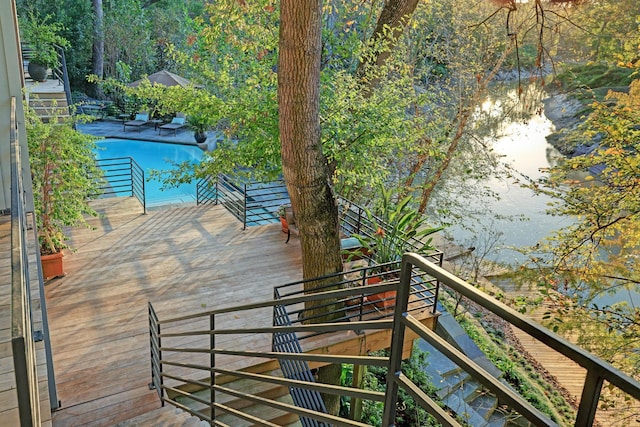 2003 Arrowwood Cir N, Houston, TX 77063 - wooden deck with a swimming pool