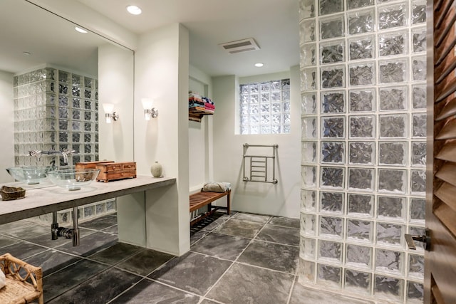 2003 Arrowwood Cir N, Houston, TX 77063 - bathroom featuring walk in shower, recessed lighting, visible vents, and stone finish floor