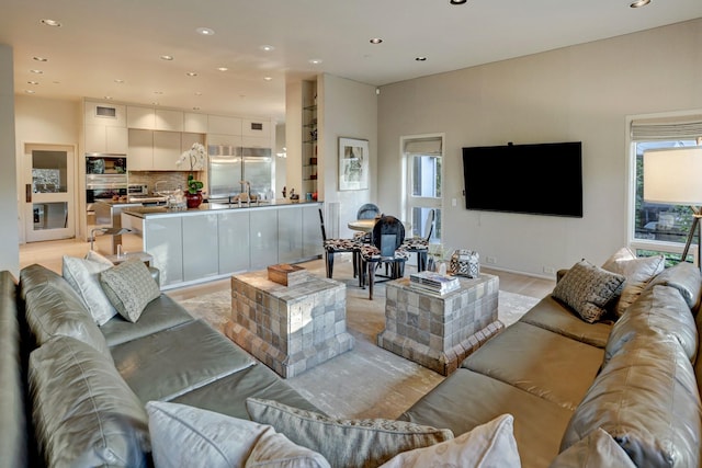 2003 Arrowwood Cir N, Houston, TX 77063 - living room with recessed lighting, light wood-style flooring, and plenty of natural light